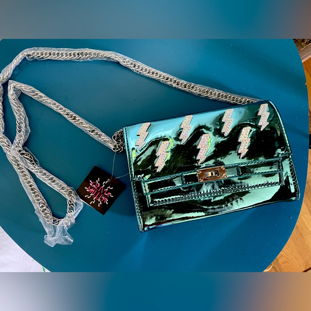 Metallic blue lighting bolt bag